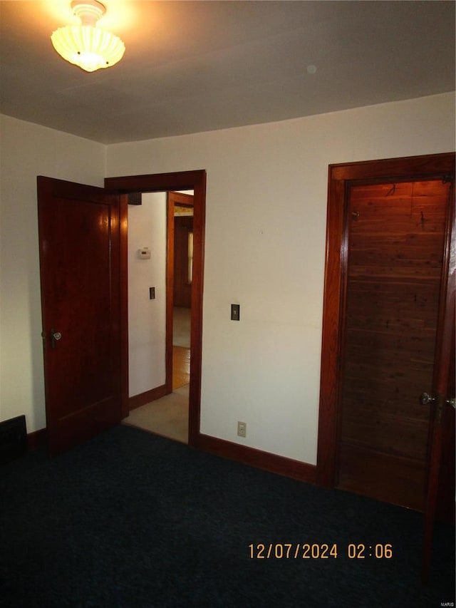 unfurnished bedroom featuring carpet floors