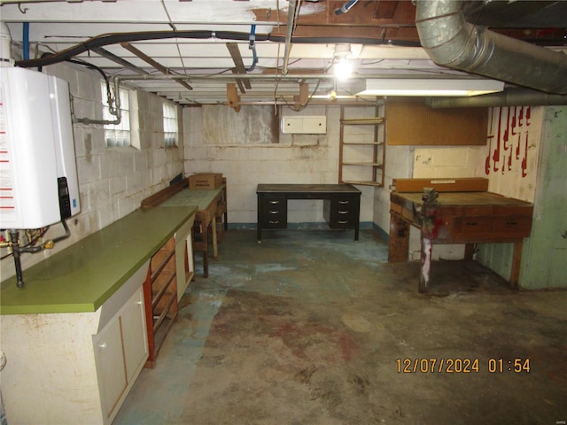 basement featuring tankless water heater