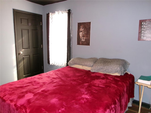 bedroom featuring hardwood / wood-style flooring