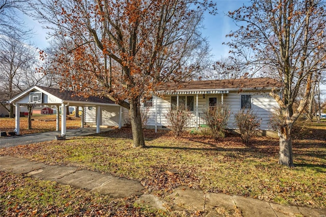 view of front of house with a garage and a carport