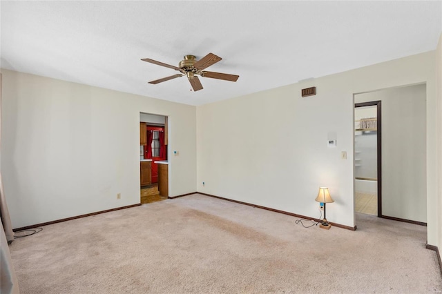 empty room with light carpet and ceiling fan