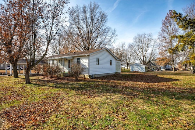 view of side of home featuring a lawn