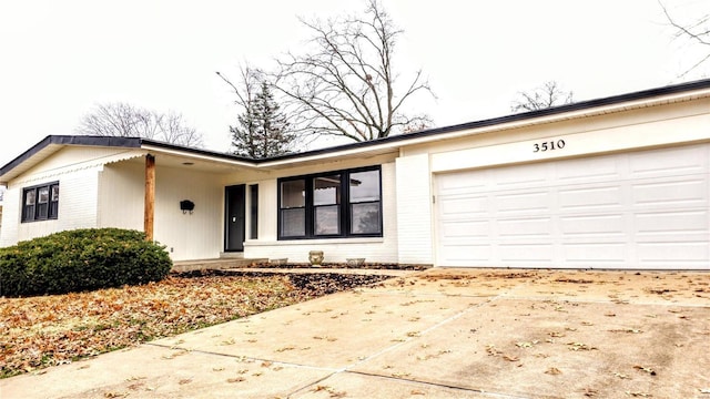 ranch-style house featuring a garage