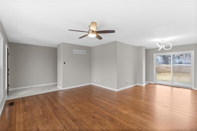 unfurnished living room featuring ceiling fan and wood-type flooring