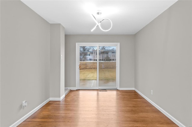 unfurnished dining area featuring wood-type flooring