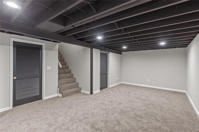 basement featuring carpet flooring