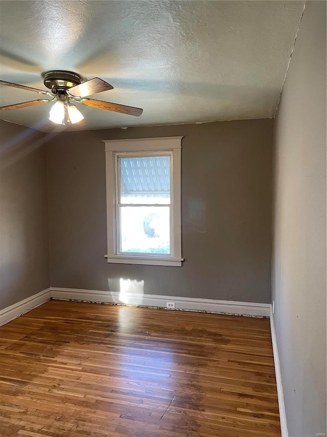 bonus room featuring ceiling fan, a textured ceiling, and hardwood / wood-style flooring