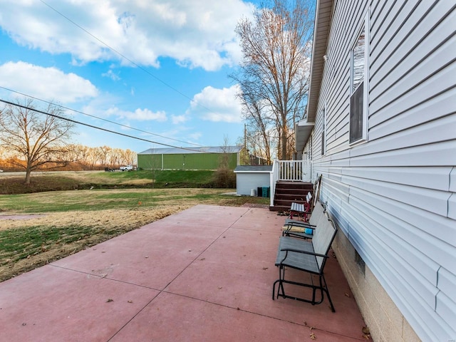 view of patio / terrace with an outbuilding