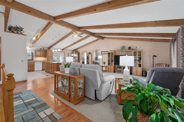 living room with light wood-type flooring, lofted ceiling with beams, and ceiling fan