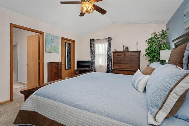 carpeted bedroom featuring ceiling fan and vaulted ceiling