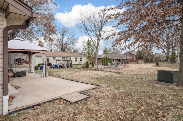 view of yard with a gazebo and a patio area