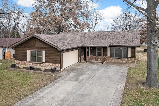 ranch-style home featuring a front yard, a porch, and a garage