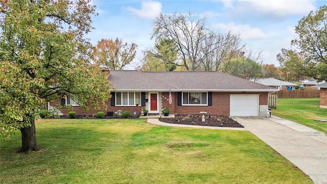 ranch-style home featuring a garage and a front lawn