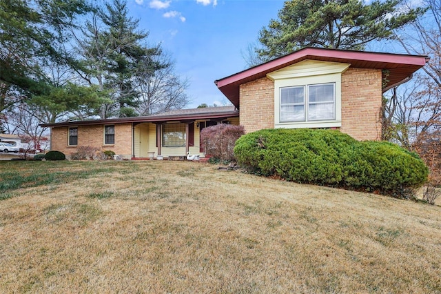 view of front of property with covered porch and a front yard