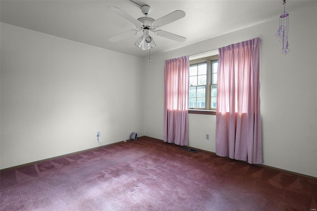 carpeted empty room with ceiling fan