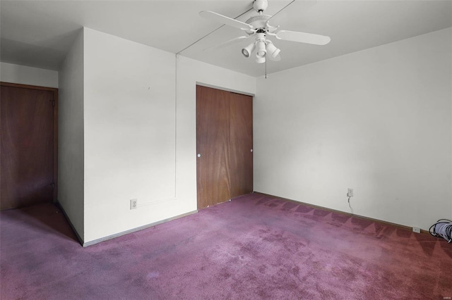 unfurnished bedroom with carpet, ceiling fan, and a closet