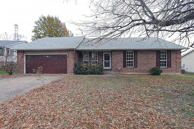 single story home with a garage