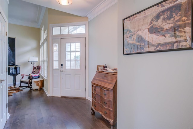 entrance foyer with dark hardwood / wood-style floors and ornamental molding