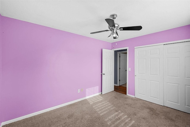 unfurnished bedroom with carpet flooring, a closet, and ceiling fan