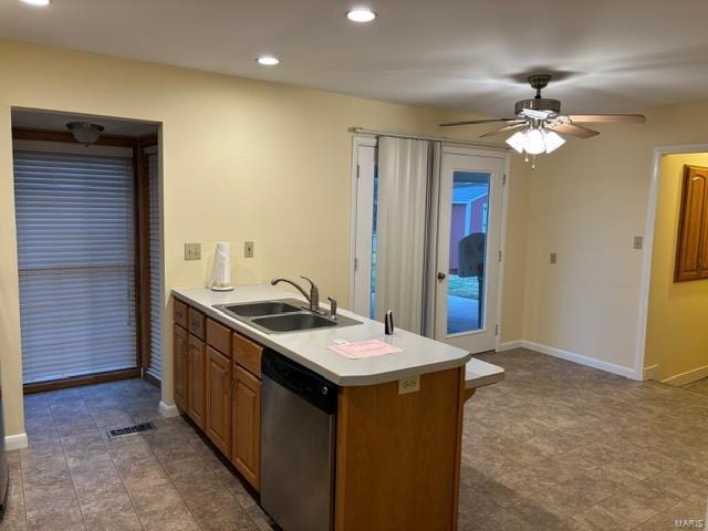 kitchen with stainless steel dishwasher, ceiling fan, kitchen peninsula, and sink