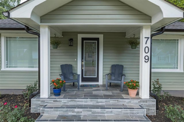 doorway to property with covered porch