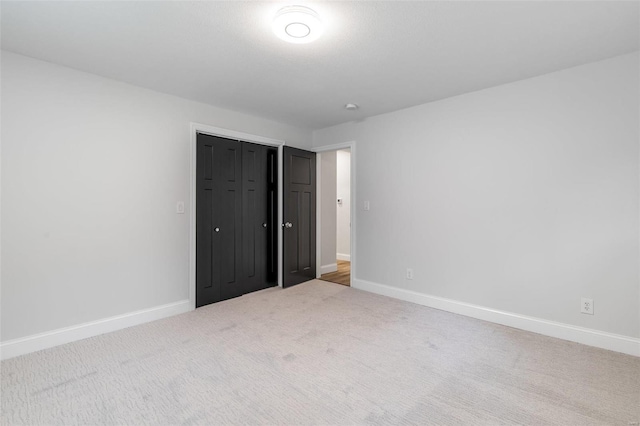 unfurnished bedroom featuring carpet