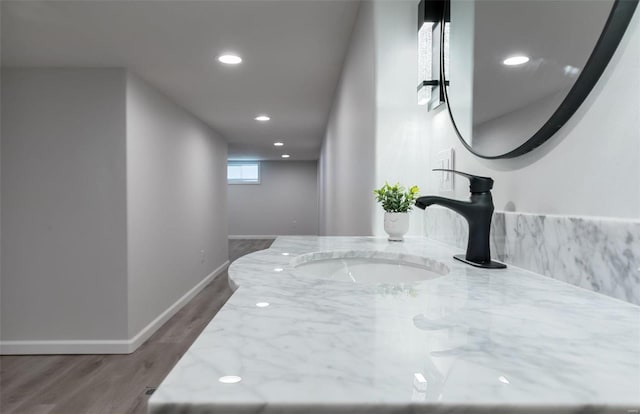 room details featuring hardwood / wood-style floors and vanity