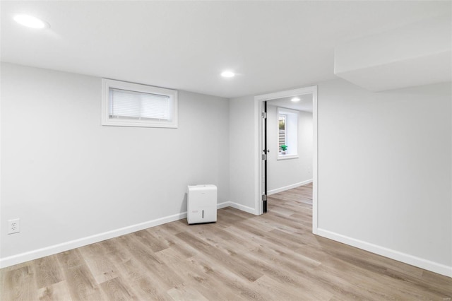 basement featuring light hardwood / wood-style floors