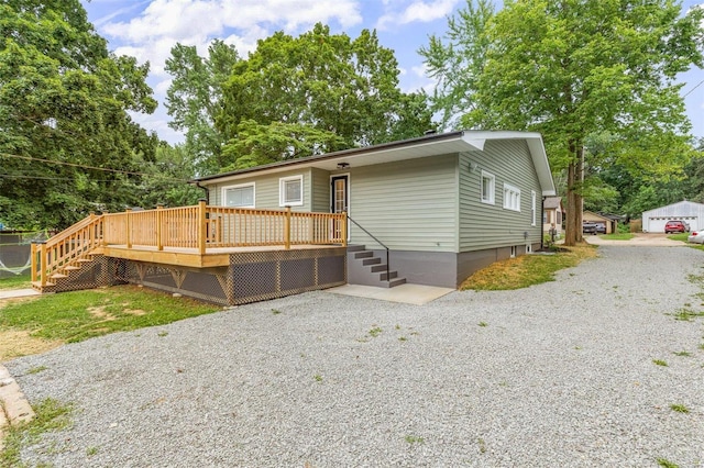 view of front facade featuring a wooden deck