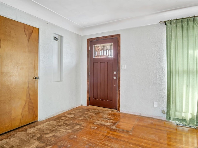 foyer entrance with wood-type flooring