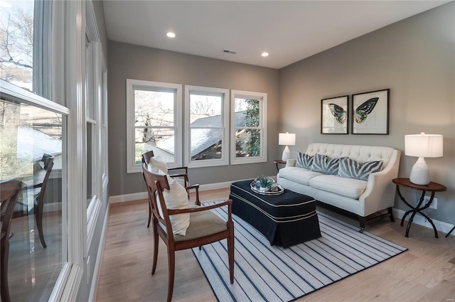 living room with light hardwood / wood-style floors