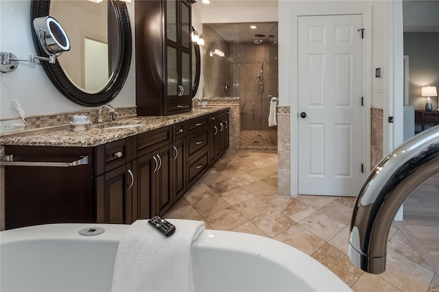 bathroom with tile patterned floors, vanity, and independent shower and bath