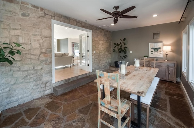 dining room featuring ceiling fan