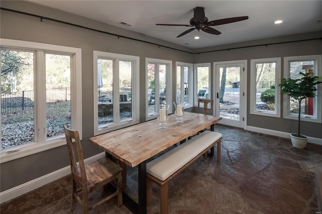 sunroom featuring ceiling fan