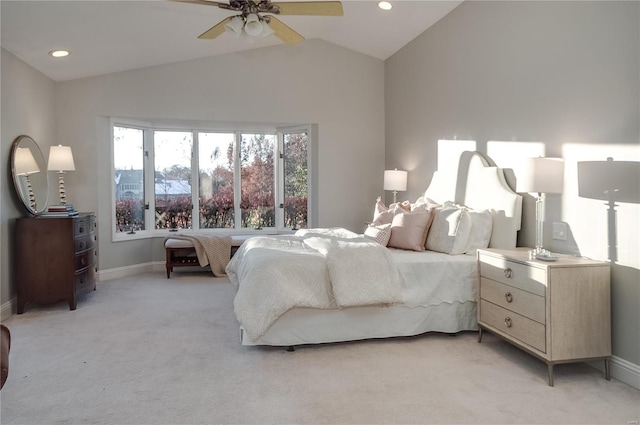 carpeted bedroom with ceiling fan and lofted ceiling