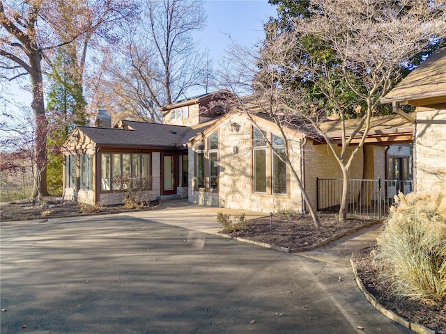 view of front of property featuring a sunroom