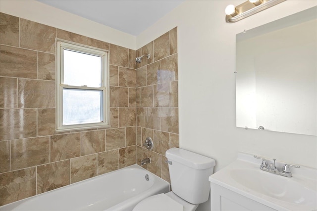 full bathroom featuring vanity, toilet, and tiled shower / bath combo