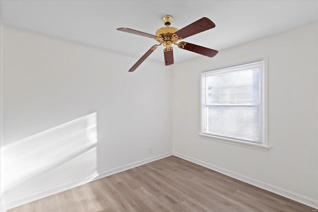 spare room with light hardwood / wood-style flooring and ceiling fan