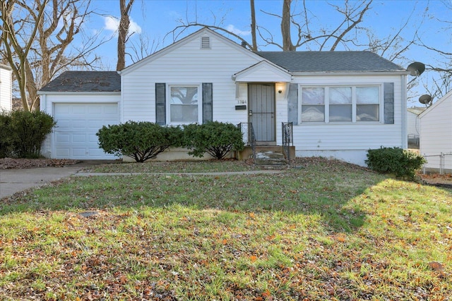 single story home featuring a front yard and a garage