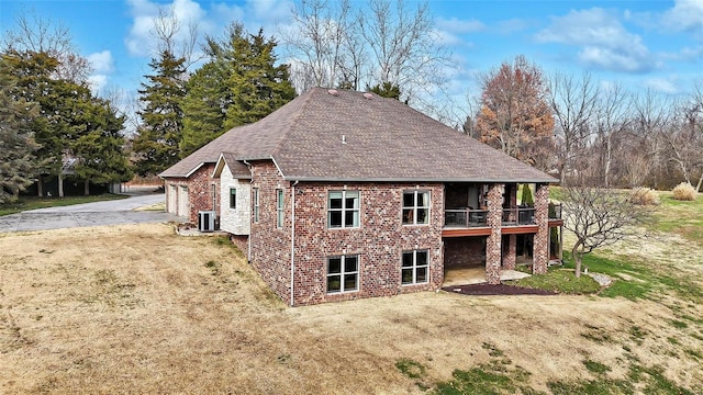 rear view of house with central AC unit, a patio, and a wooden deck