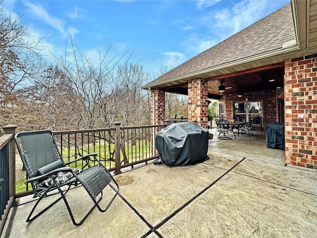 view of patio / terrace with ceiling fan and a grill