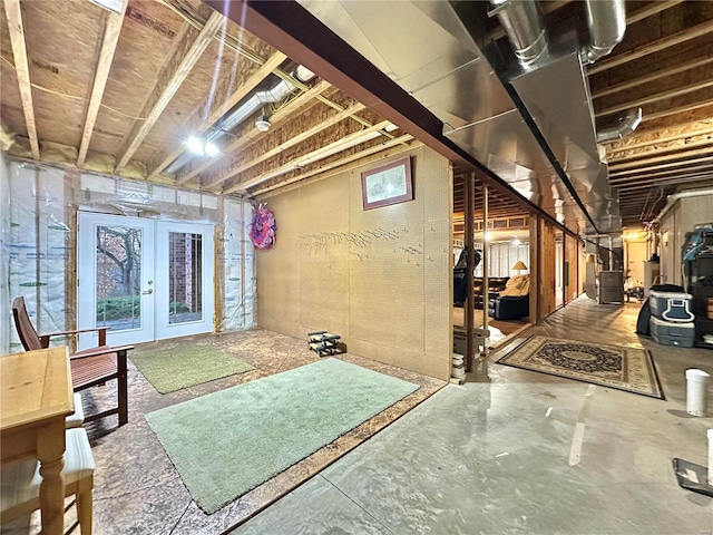 basement with french doors and heating unit