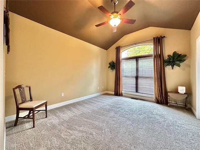 unfurnished room featuring carpet, vaulted ceiling, and ceiling fan