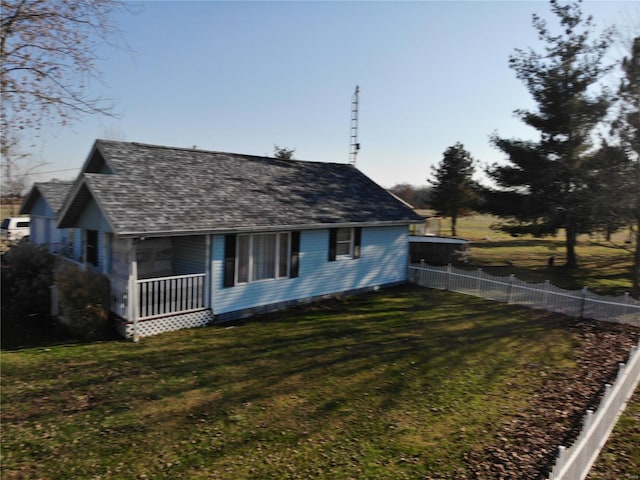 view of side of property featuring a yard