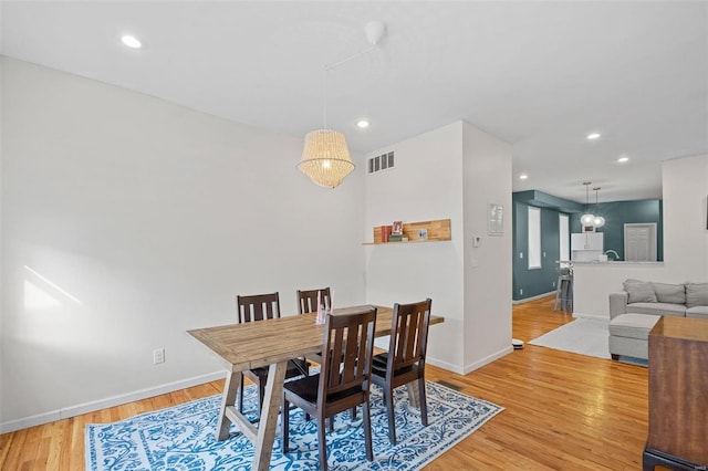 dining space featuring visible vents, recessed lighting, baseboards, and wood finished floors