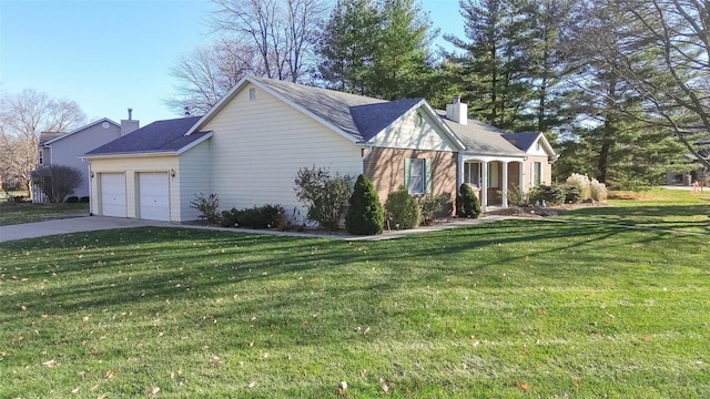 view of home's exterior with a yard and a garage