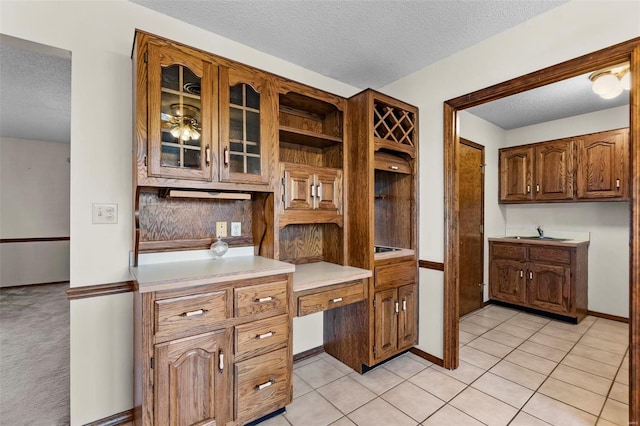 kitchen with light tile patterned floors and a textured ceiling