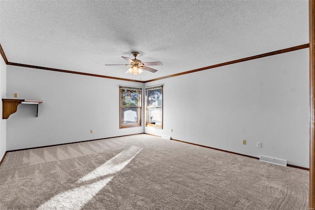 carpeted spare room featuring ceiling fan and a textured ceiling