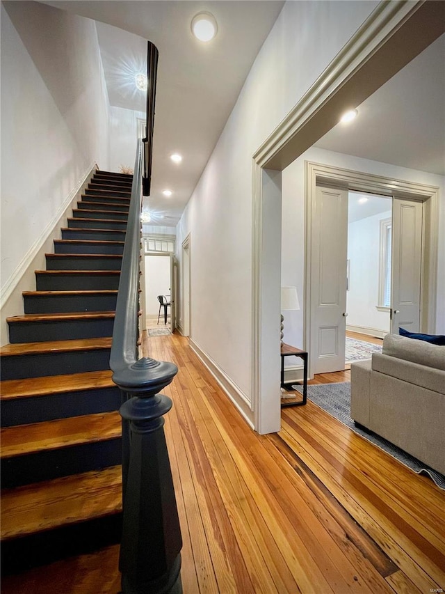 stairway featuring wood-type flooring