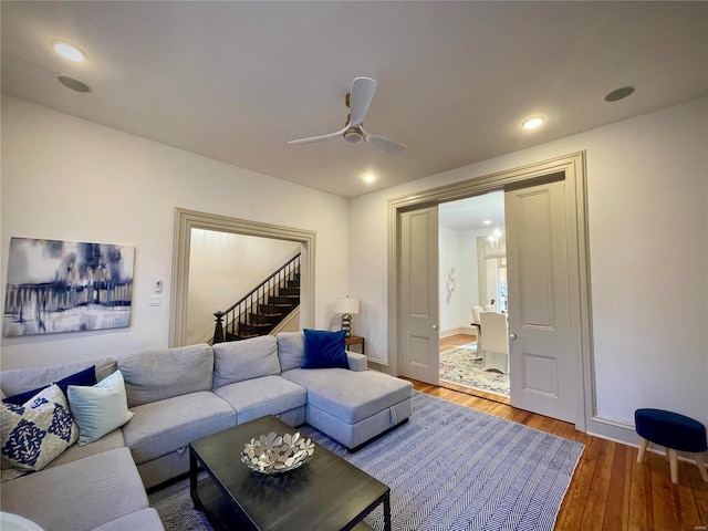 living room featuring hardwood / wood-style flooring and ceiling fan